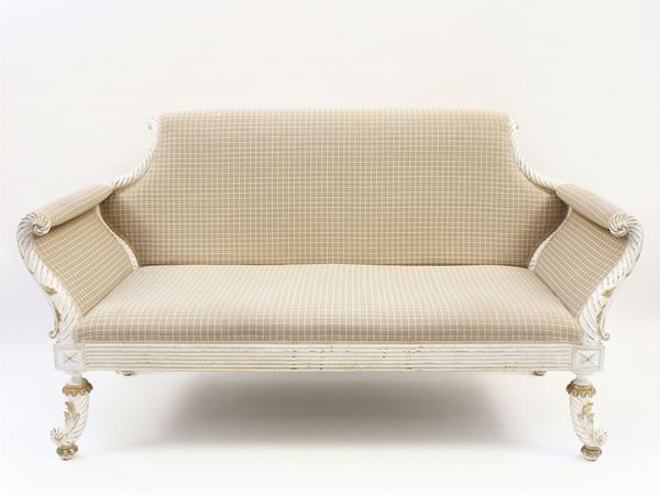 A small white painted wooden sofa