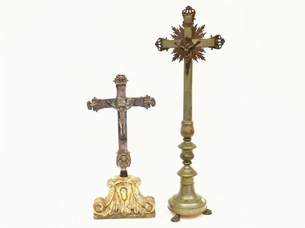 A metal crucifix with silver Christ and details