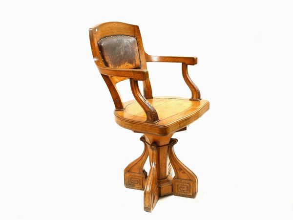 An oak revolving armchair