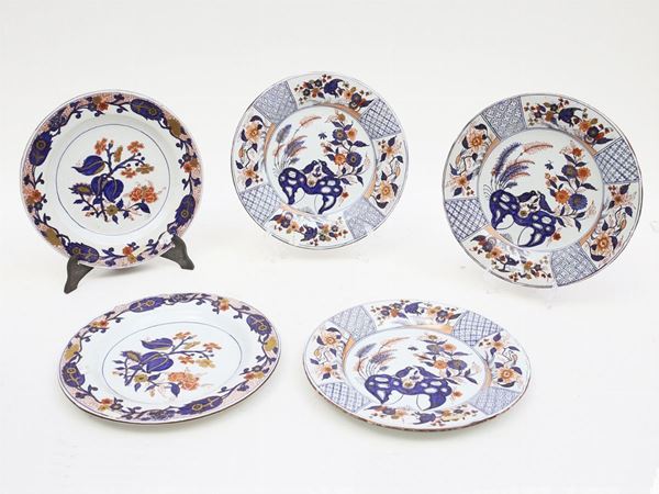 Three sets of four maiolic plates