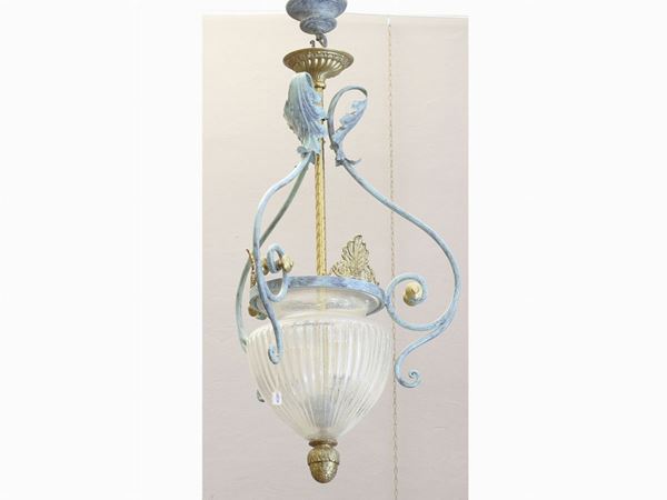 A wrought iron, metal and glass chandelier  - Auction Antiquities, Interior Decorations and Vintage  from the Panarello Gallery in Taormina - Maison Bibelot - Casa d'Aste Firenze - Milano