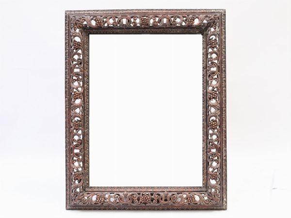 A walnut framed wall mirror