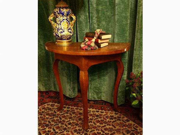 A pair of small walnut console tables