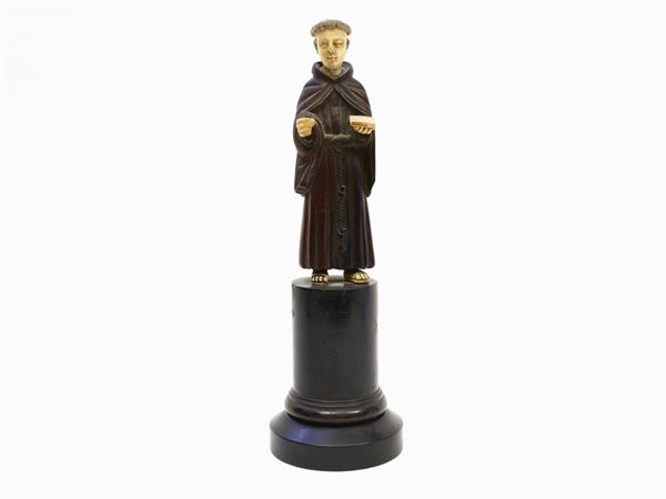 A wooden Friar sculpture