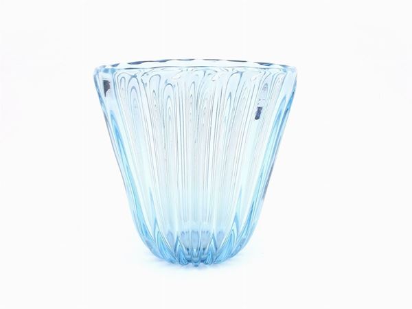 A large blue blown glass vase