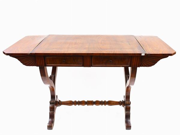 A mahogany veneered desk table