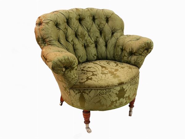 A damask upholstered armchair
