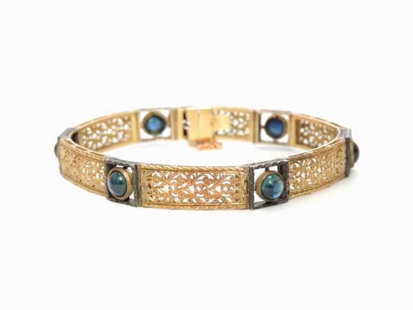 Yellow gold and silver bracelet with synthetic sapphires