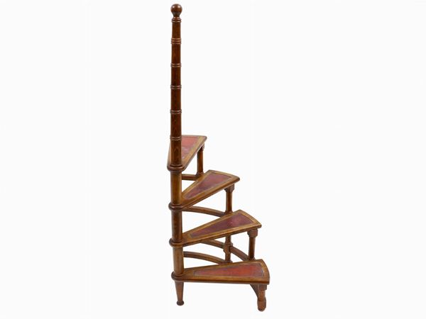 A library spiral ladder in walnut  - Auction Antiquities, Interior Decorations and Vintage  from the Panarello Gallery in Taormina - Maison Bibelot - Casa d'Aste Firenze - Milano