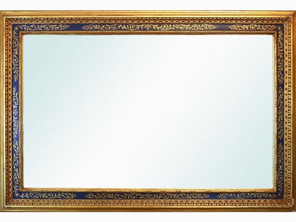 A wall mirror with giltwood and pastiglia frame