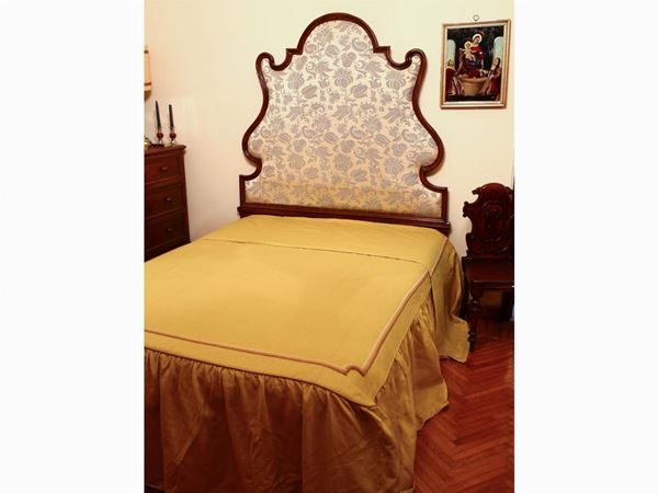 An upholstered France bed headboard