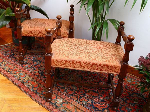 A pair of walnut stools