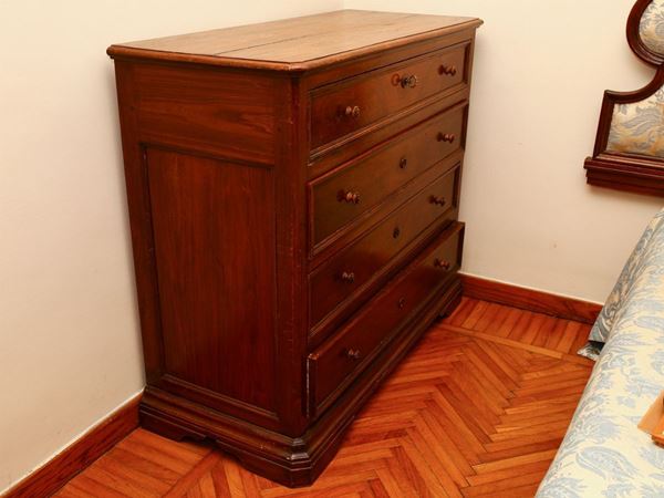 A walnut chest of drawer