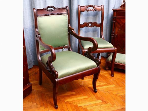 A mahogany armchair with a pair of chairs