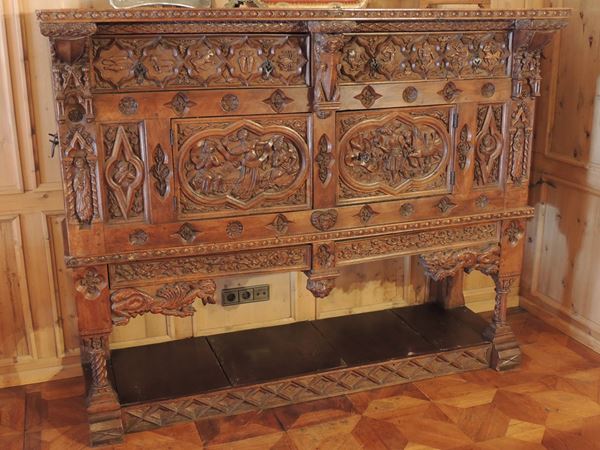 A tyrolean walnut sideboard carved with Zodiac signs