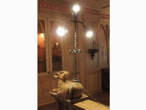 A pair of large softwood and wrougth iron lamps