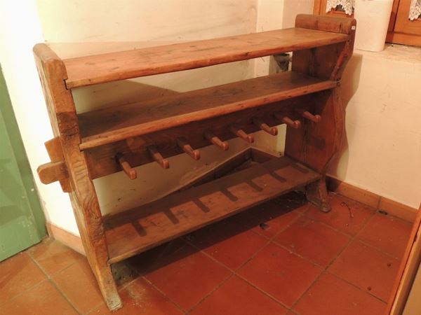 A rustic softwood boots holder