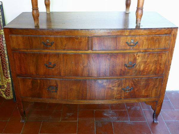 A walnut veneered chest of drawer