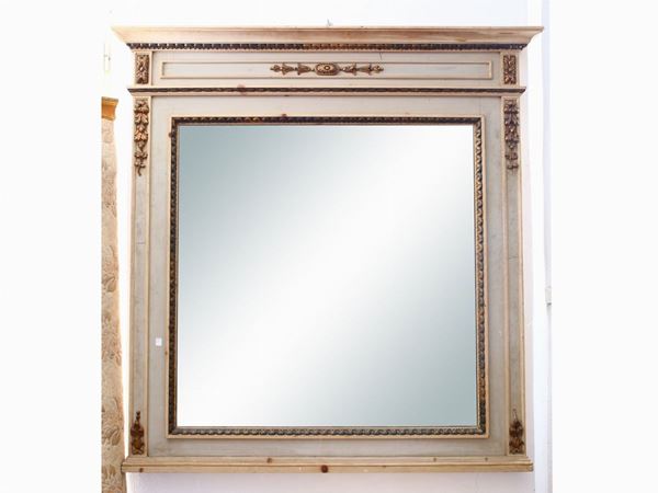 A lacquered wooden framed mirror