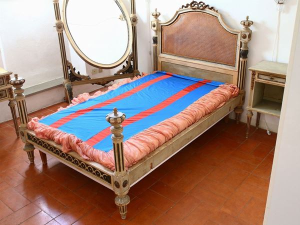 A lacquered wooden bed