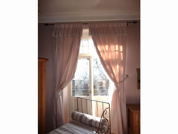 Three pairs of pink fabric curtains