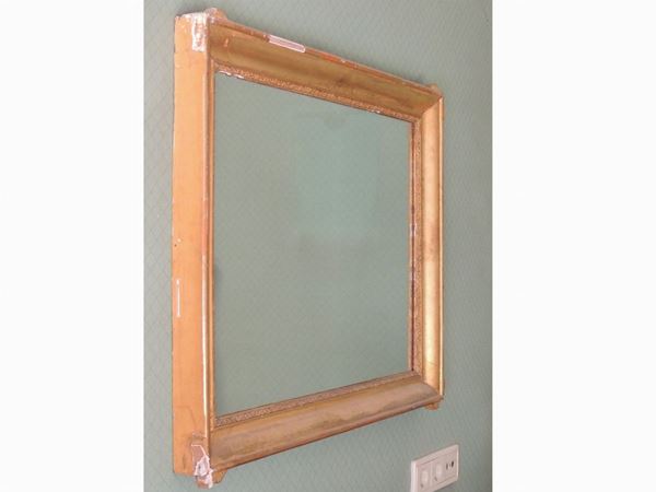 A small giltwood framed mirror