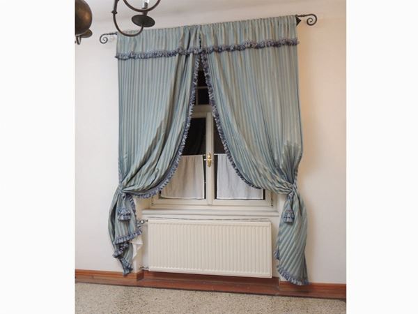 A lot of fabric curtains and furnishing