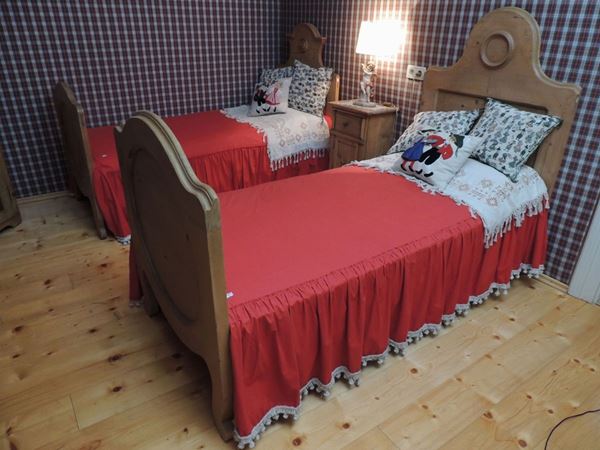 A child's Tyrolean softwood bed and fabrics