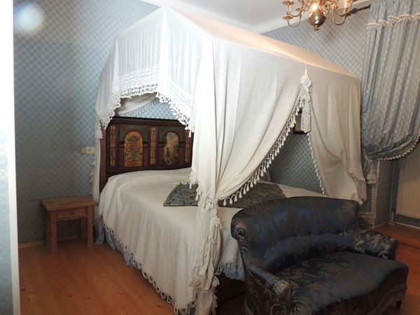 A Tyrolean canopy double bed
