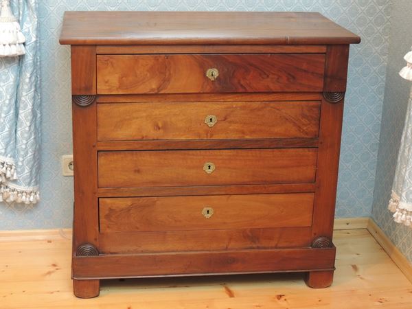 A small cherrywood veneered chest of drawers