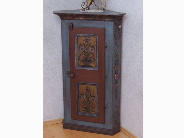 A small Tyrolean corner cabinet