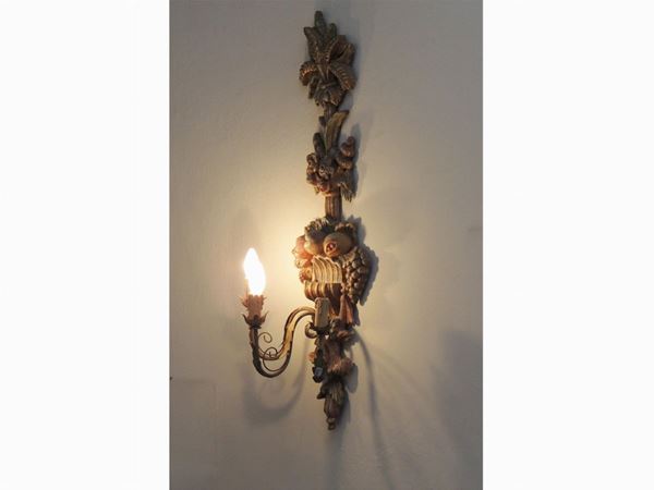 A pair of large wooden sconces
