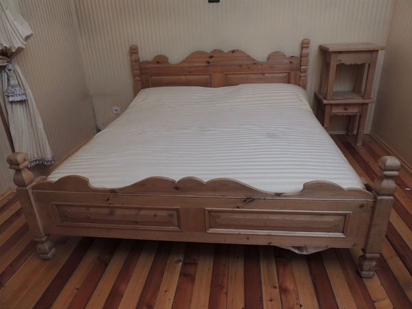 A Tyrolean softwood double bed