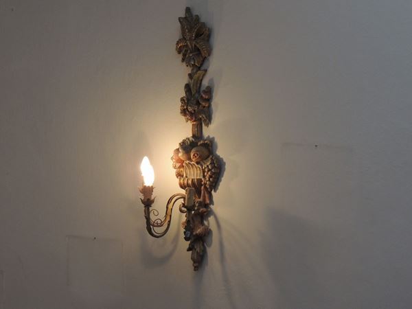 A pair of large wooden sconces