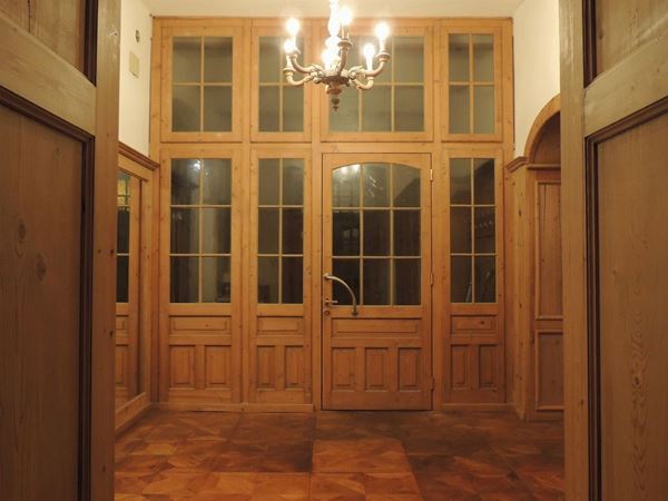 A large wooden and glass atrium door