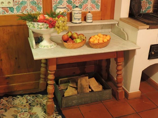 A firwood and marble kitchen service table