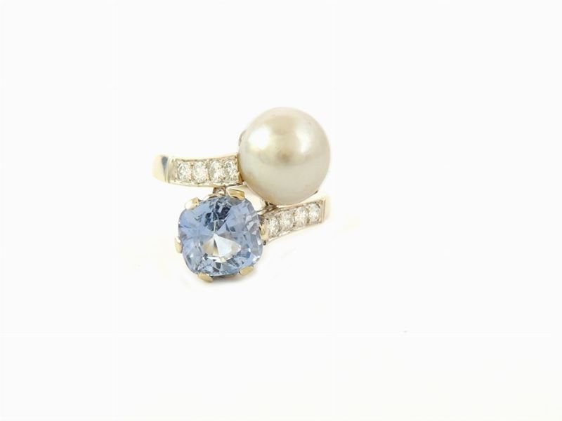 Anello Contrarié in Oro Bianco con Zaffiro e Perla