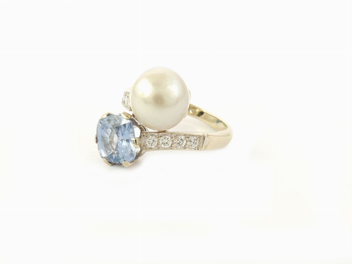 Anello Contrarié in Oro Bianco con Zaffiro e Perla