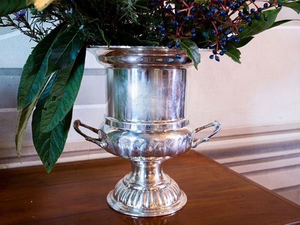 A large silver plated ice bucket