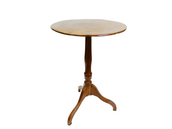A small circular walnut table