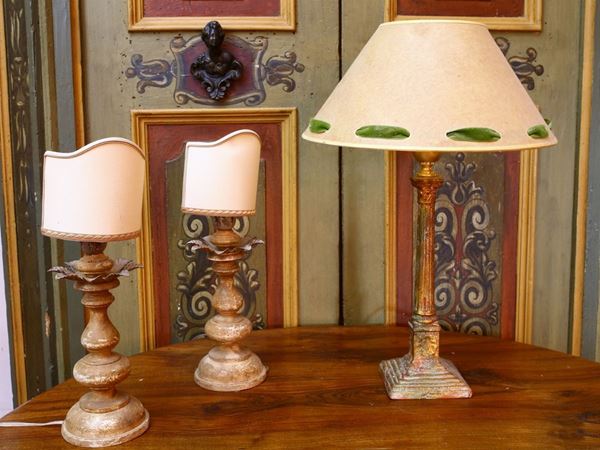 Three curved wooden table lamps