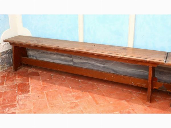 A pair of rustic softwood benches