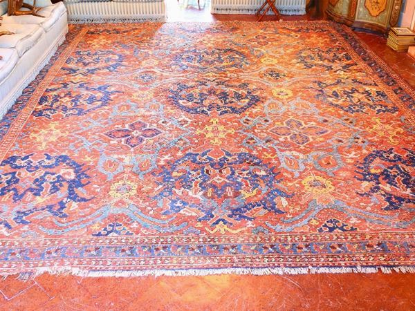 A large old manufactured Caucasic carpet