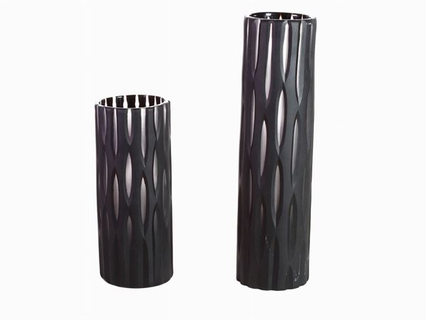 A pair of grounded black and white glass vases