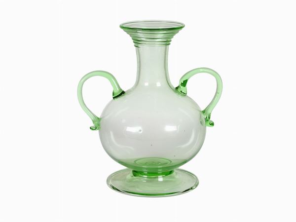 A pale green blown glass vase with applied handles