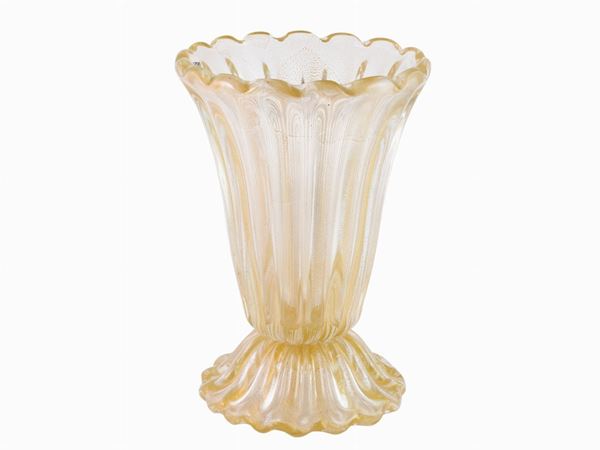 A costolato glass vase with golden leaf