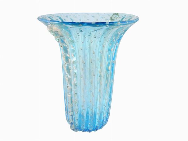 A big costolato light blue glass vase with bubbles and applied ribs