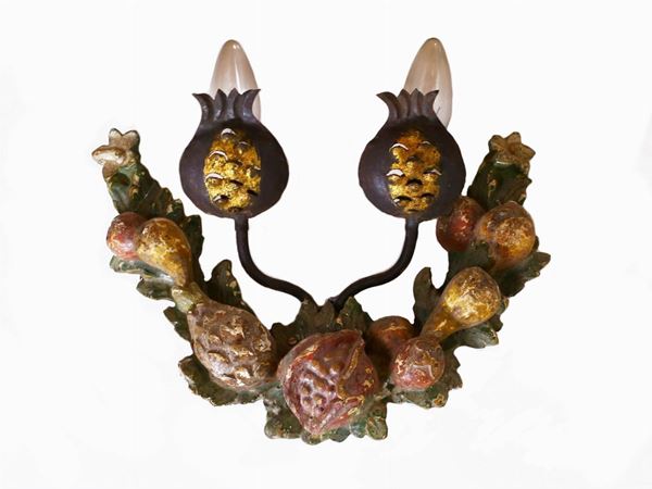 A set of three wooden sconces