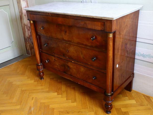 A walnut veneered chest of drawer