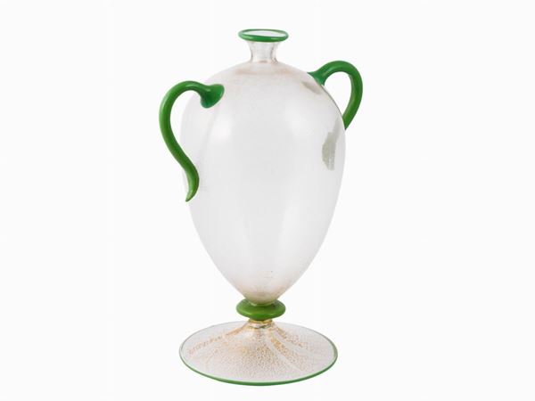 An amphora shaped vase with gold leaf with applied green handles